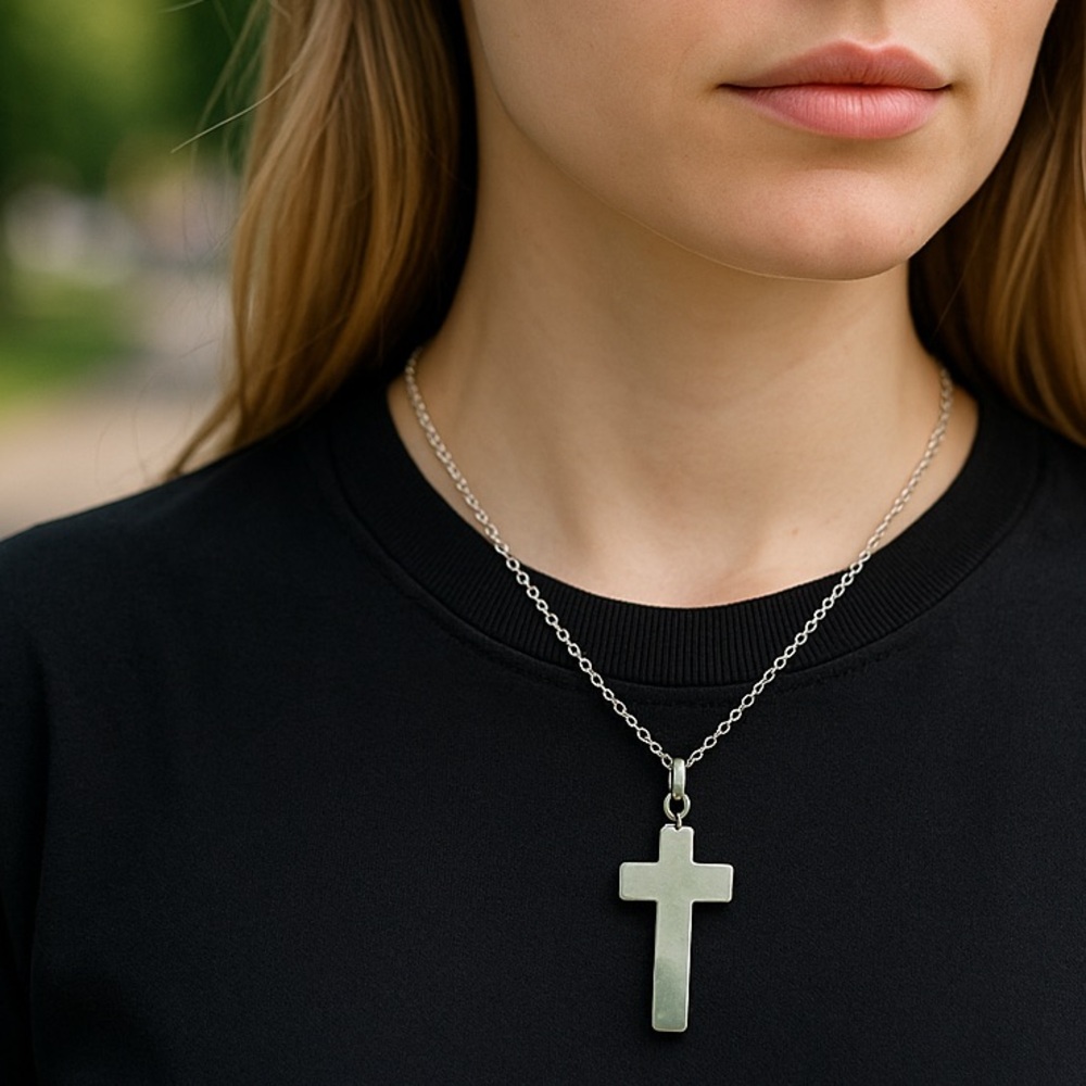 Carved stone Cross pendant set in silver plus a stainless steel necklace